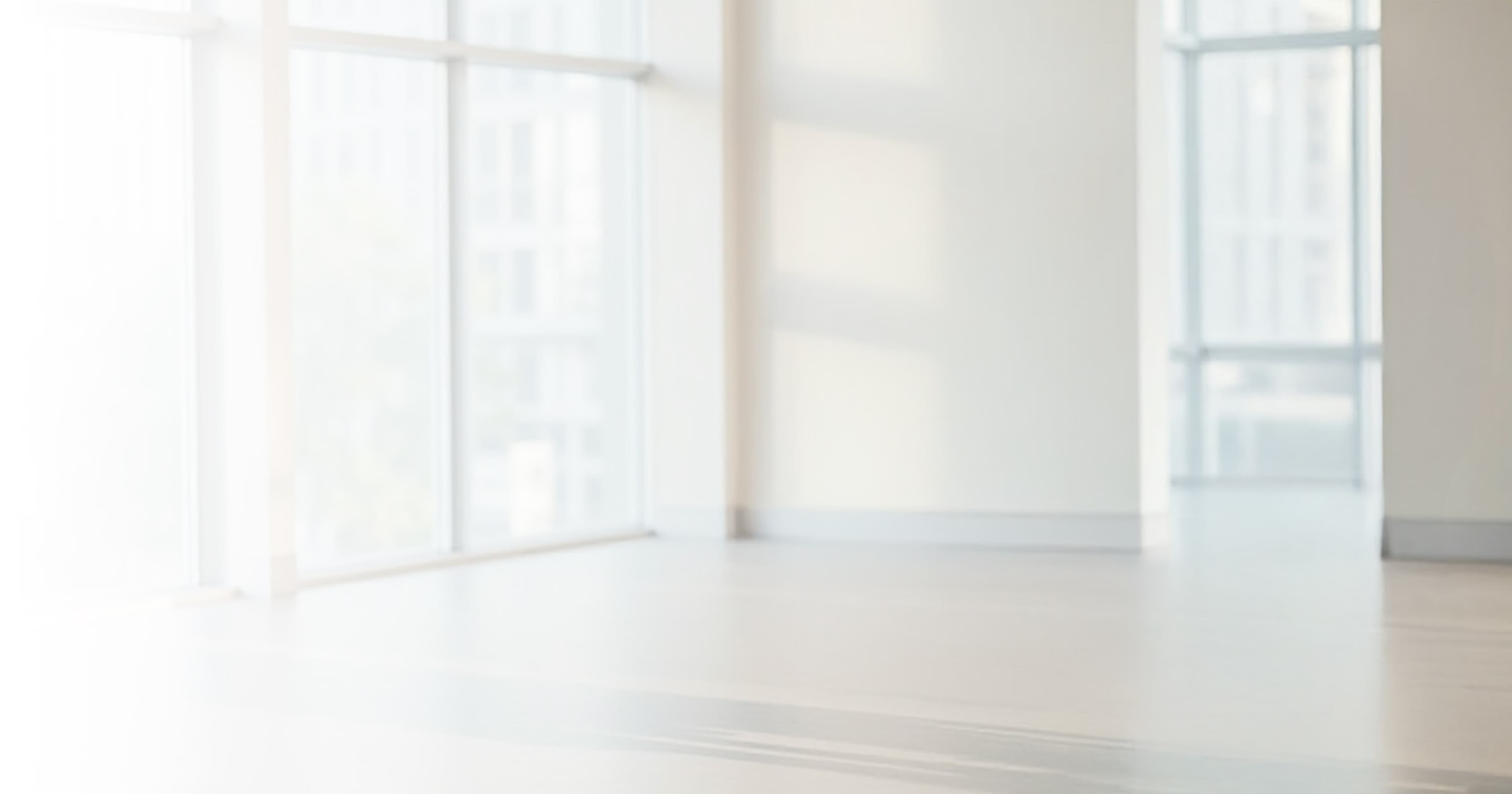 Bright minimalist interior space with large windows and natural light