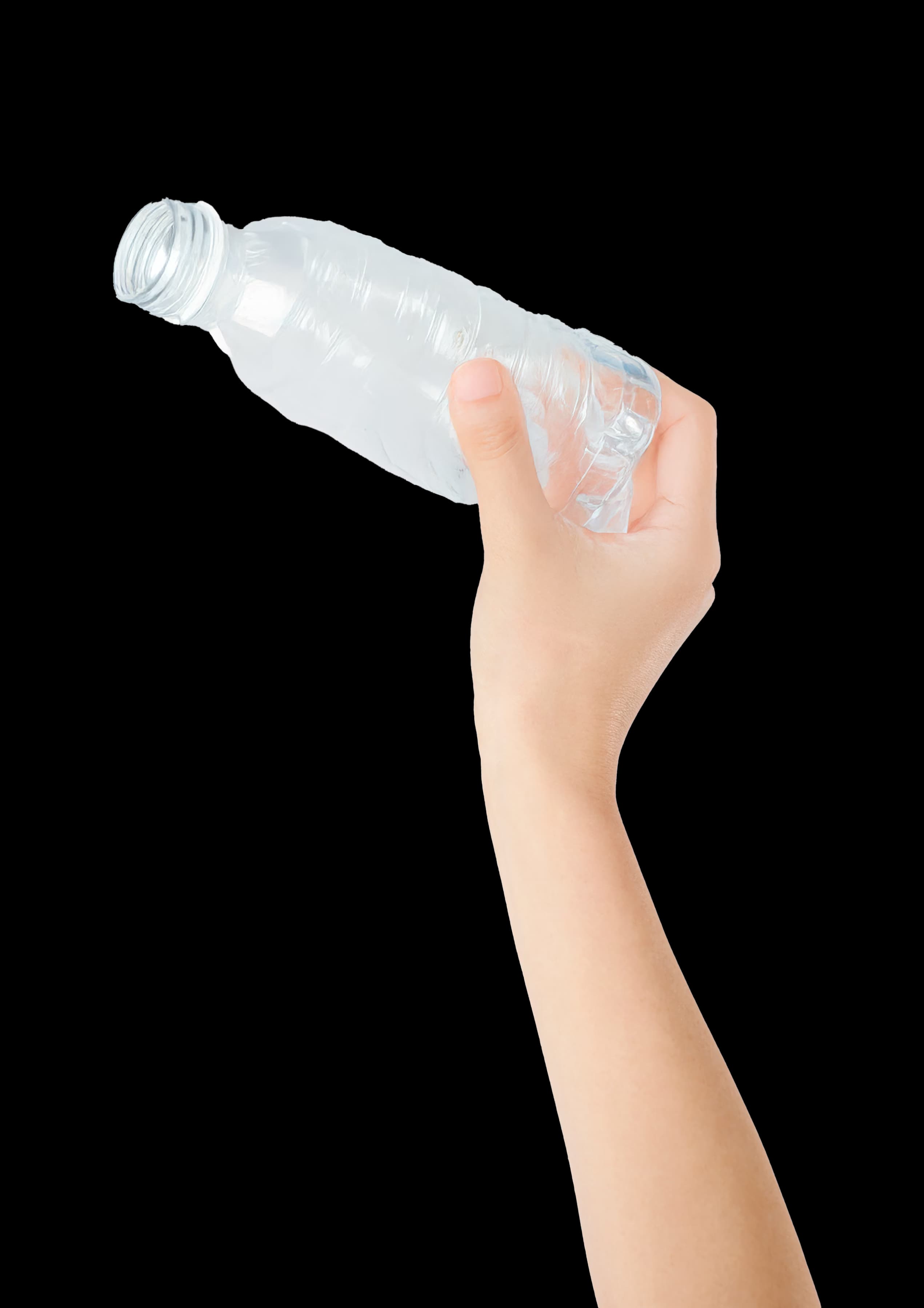 Hand holding a used plastic bottle for disposal