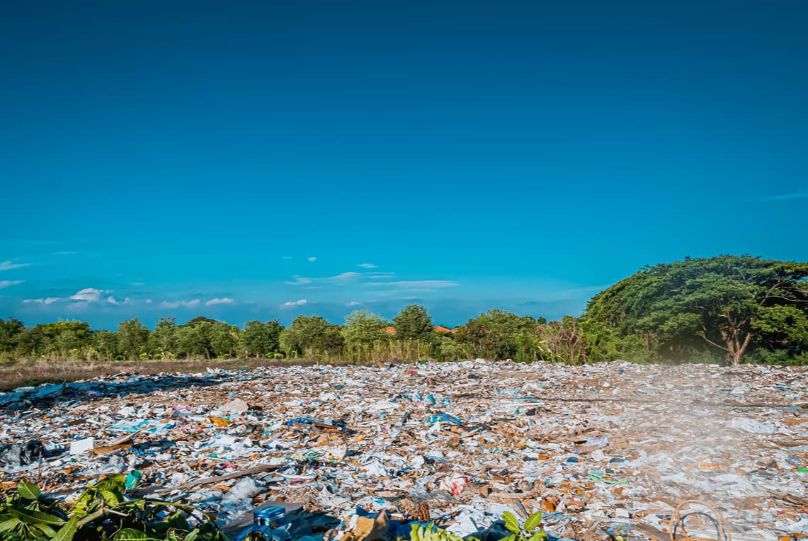 An open landfill full of unmanaged waste